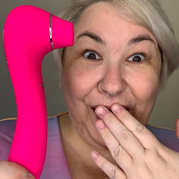 Pink Senna Sonic Clitoral Stimulator from Savvy-Viva, featuring a unique design for pleasurable sensations.