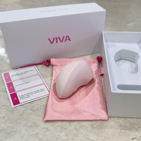 Pink clitoral stimulator kit by VIVA, includes lube, cleaner, and storage pouch in a gift box.