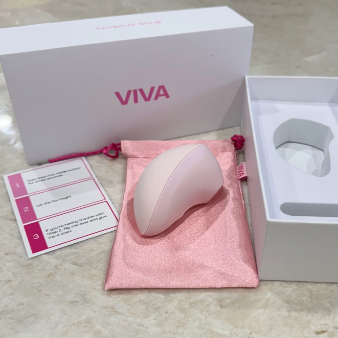 Pink clitoral stimulator kit by VIVA, includes lube, cleaner, and storage pouch in a gift box.