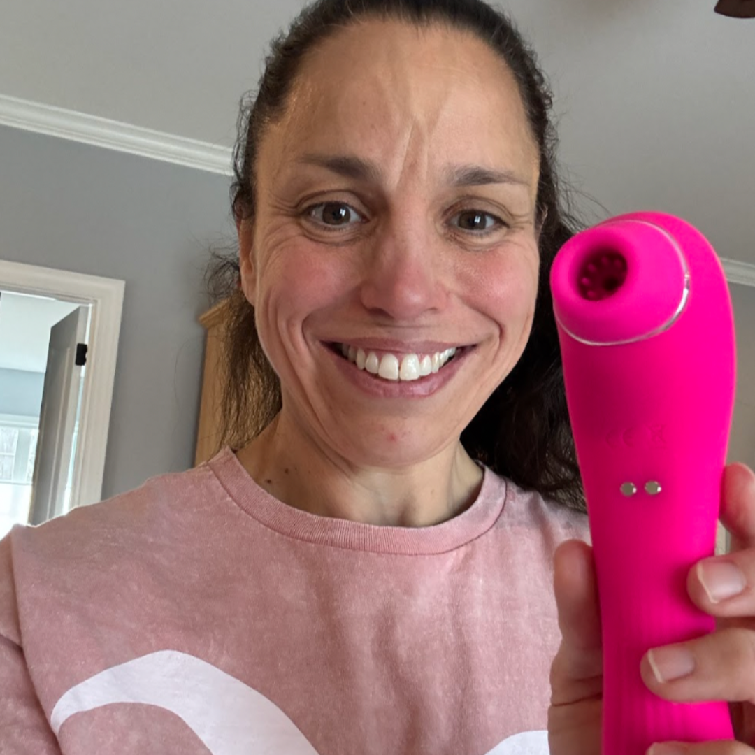 Pink clitoral stimulator from the Mr. & Mrs. Vibe Couples Intimacy Bundle by VIVA, featuring ergonomic design and buttons.